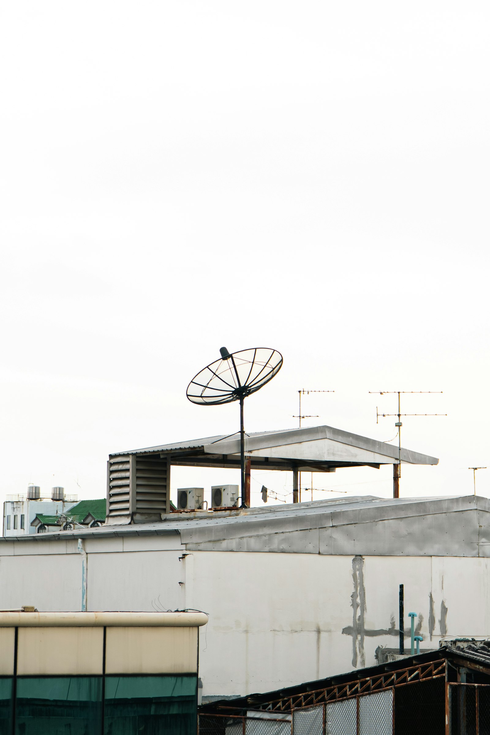 Rooftop antenna and dish setup on high vantage structure