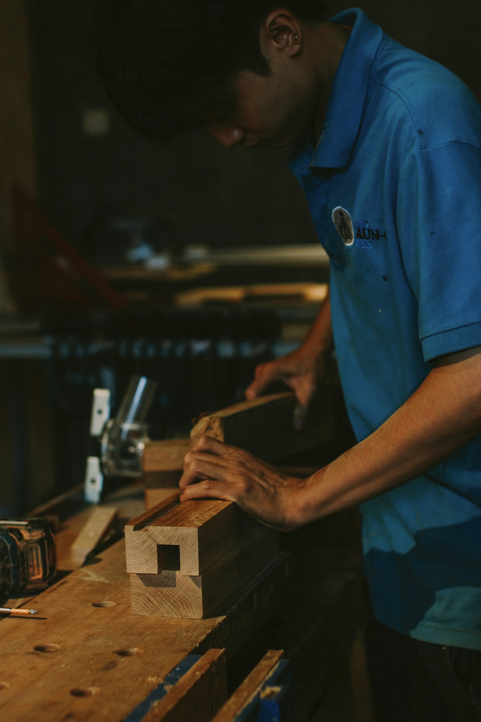 Paul working carefully with timber joinery at a workbench